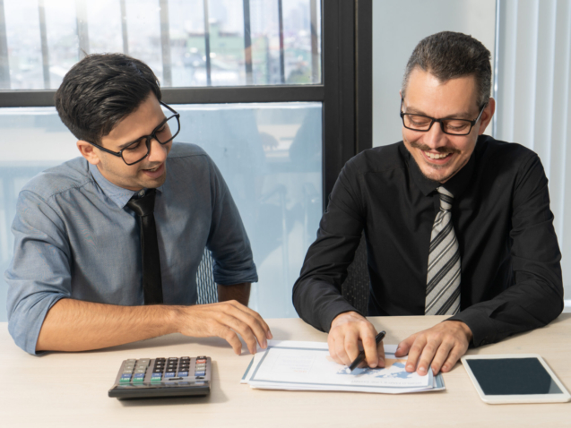 Chartered accountants discussing about the accounts